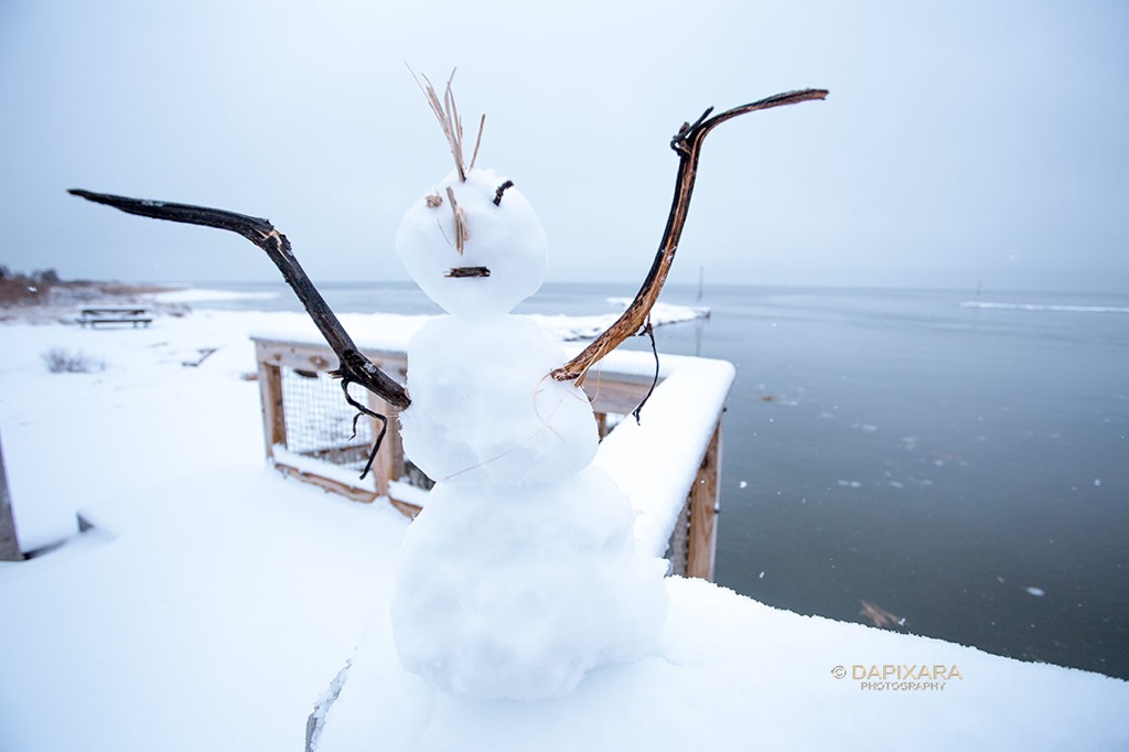 A fresh snow warning has been issued, do not approach this aggressive mob ( snowman ).  Location: Rock Harbor beach, Orleans, Ma, Cape Cod. © Dapixara.