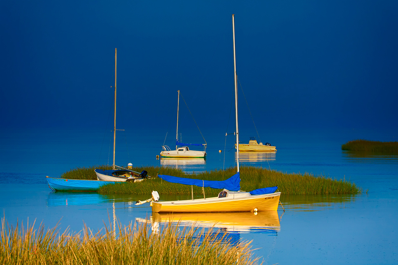 Boat Meadow. Boats on the Meadow and turquoise water in Massachusetts, Eastham, Cape Cod Bay. Dapixara fine art photography. Colors: teal, steel blue, midnight blue.