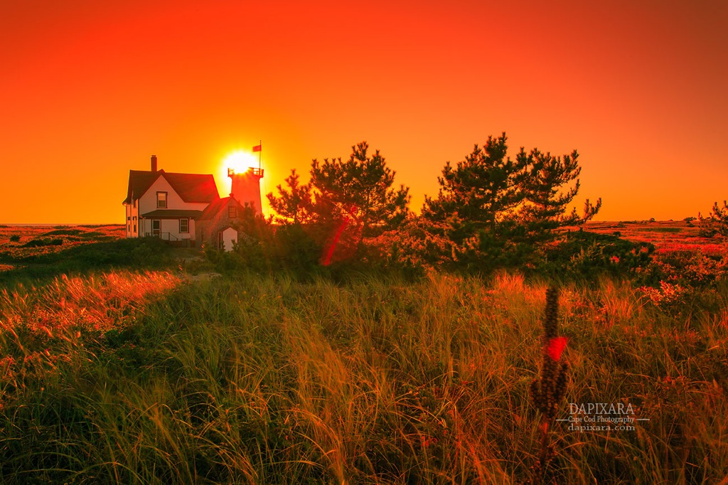 The sun places itself perfectly on the Stage Harbor Lighthouse in Chatham Cape Cod. Dapixara photography https://dapixara.com