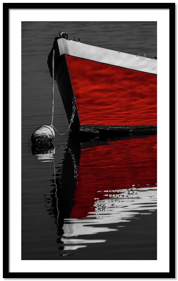 framed black and white photography red boat 2