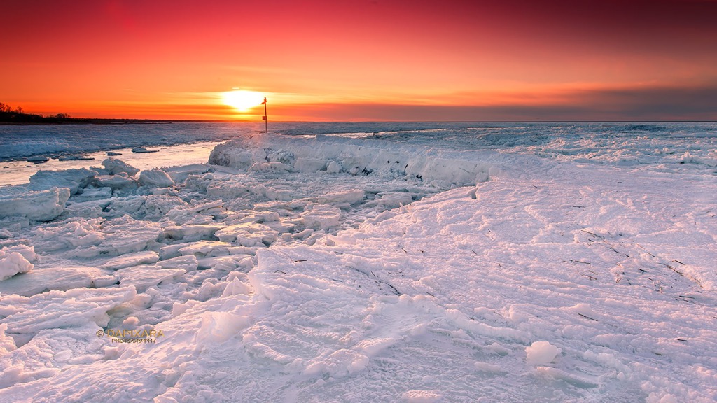 Tonight's scenic sunset with some snow and ice in Rock harbor beach, Orleans, Massachusetts. Get ready for some sunshine this week!  Frozen sunset at Rock Harbor, Orleans, Cape Cod, USA. © Dapixara Cape Cod news.