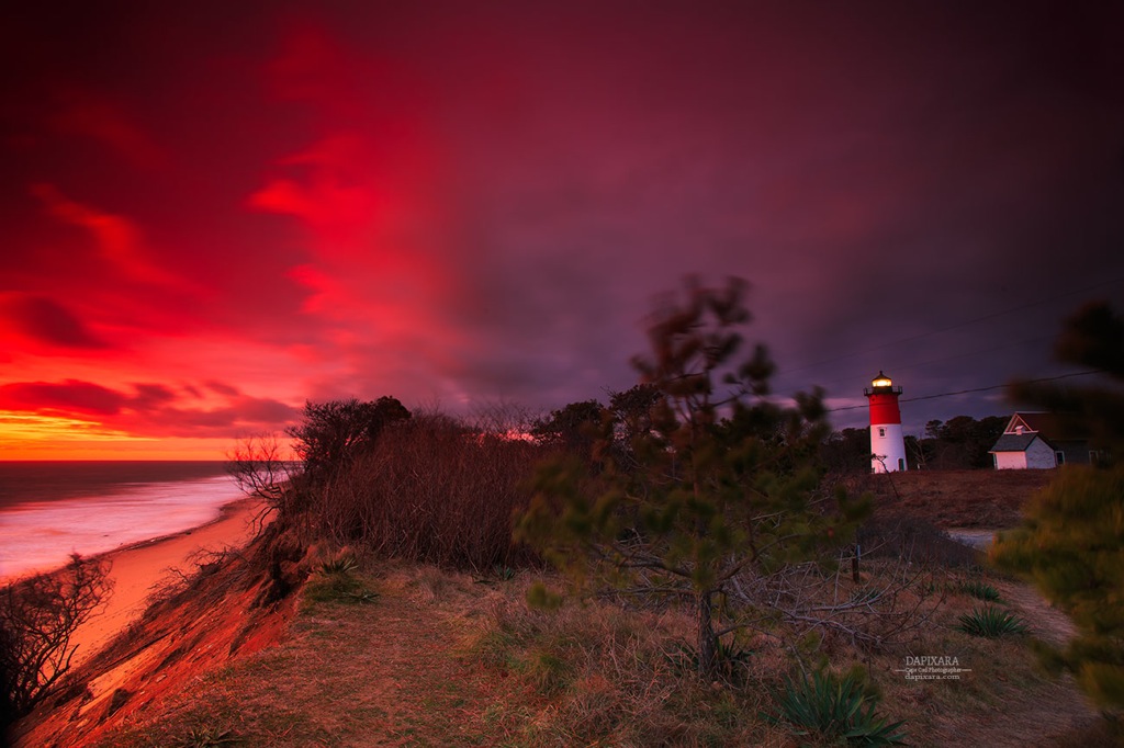 Nauset lighthouse. Today's alluring sunrise with snow, storm clouds rolling in. Cape Cod National Seashore photography by Dapixara https://dapixara.com