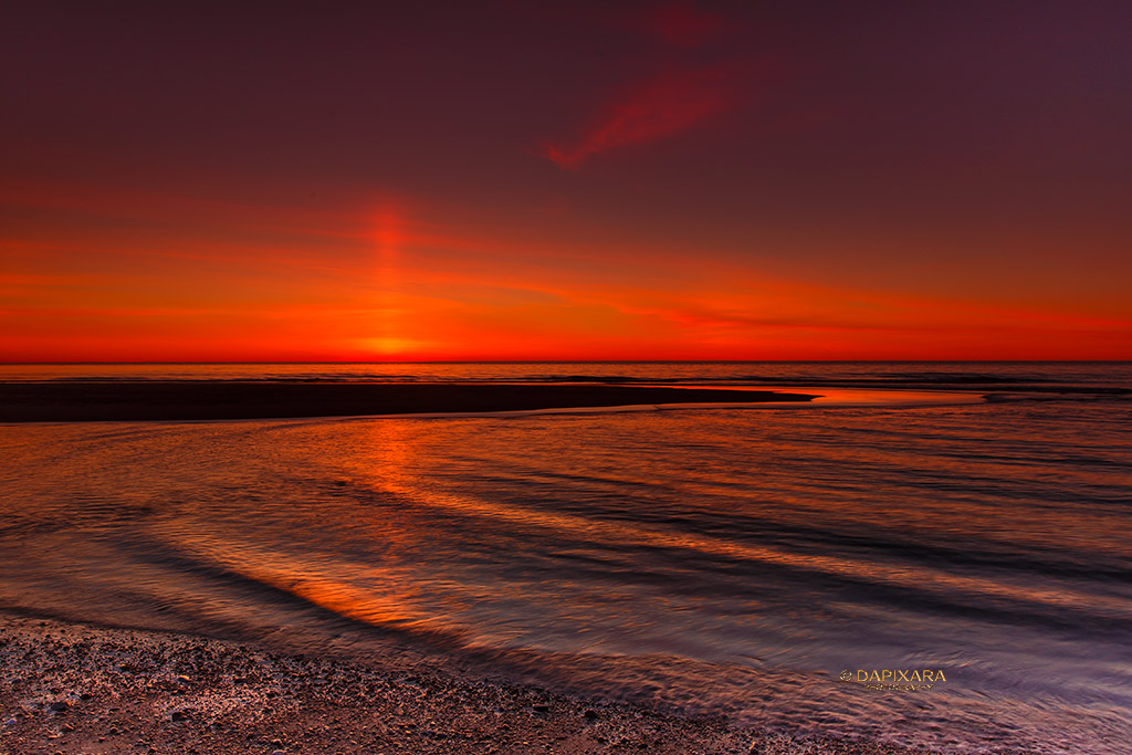 Spectacular sun pillar at Nauset beach this morning.  Sunrise at Nauset beach, Orleans, Massachusetts, Cape Cod. © dapixara