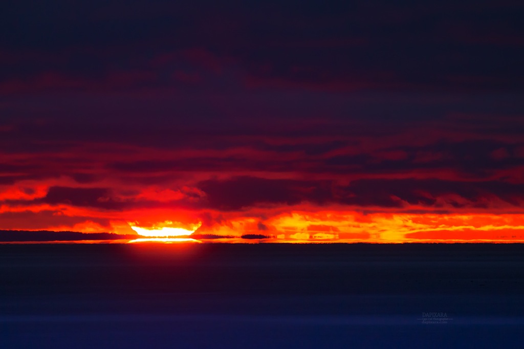 Today's burst of sunset over calm Cape Cod Bay in Wellfleet! Photo by Dapixara