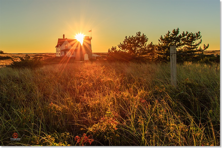 The last rays of sunset over Chatham light in Cape Cod. Dapixara photograph.