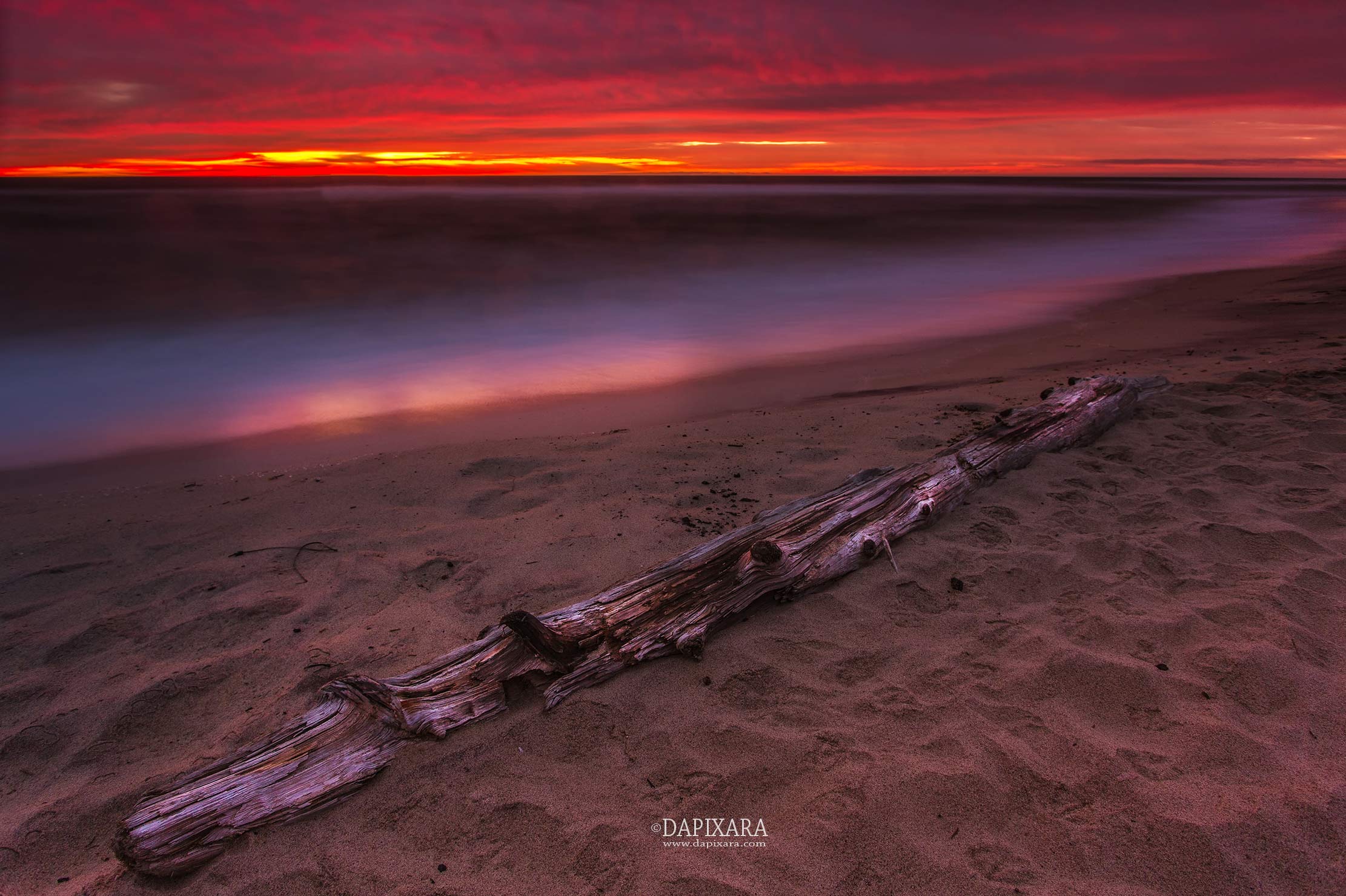 Wicked sunrise over Newcomb Hollow beach in Wellfleet, Cape Cod. Photographer Dapixara.