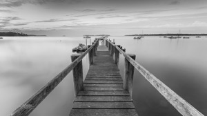 Black-and-White panorama photograph of Boat Dock at Sunrise on Pleasant Bay, Massachusetts, USA. Wall art for beach house decor by photographer Dapixara.