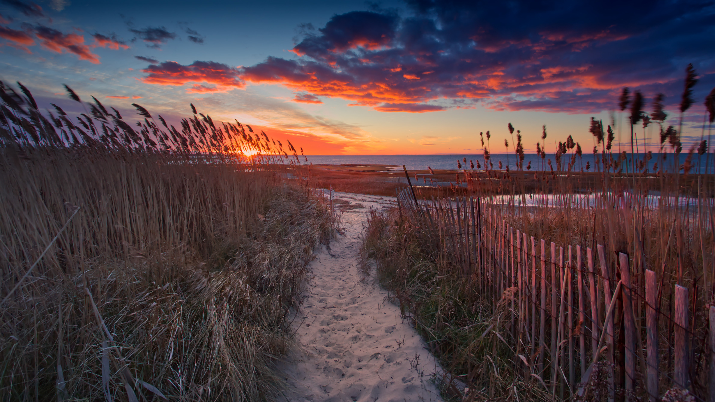 Bring the beauty of Cape Cod's picturesque coastline into your home with this stunning beach sunset and fence art print. Professionally printed on high-quality paper using archival inks, this art print will last for years to come. Perfect for beach lovers and art enthusiasts, our beach art prints are carefully inspected and packaged to ensure they arrive in perfect condition. Shop now and add a touch of tranquility and serenity to your living space with this captivating piece of coastal art.
