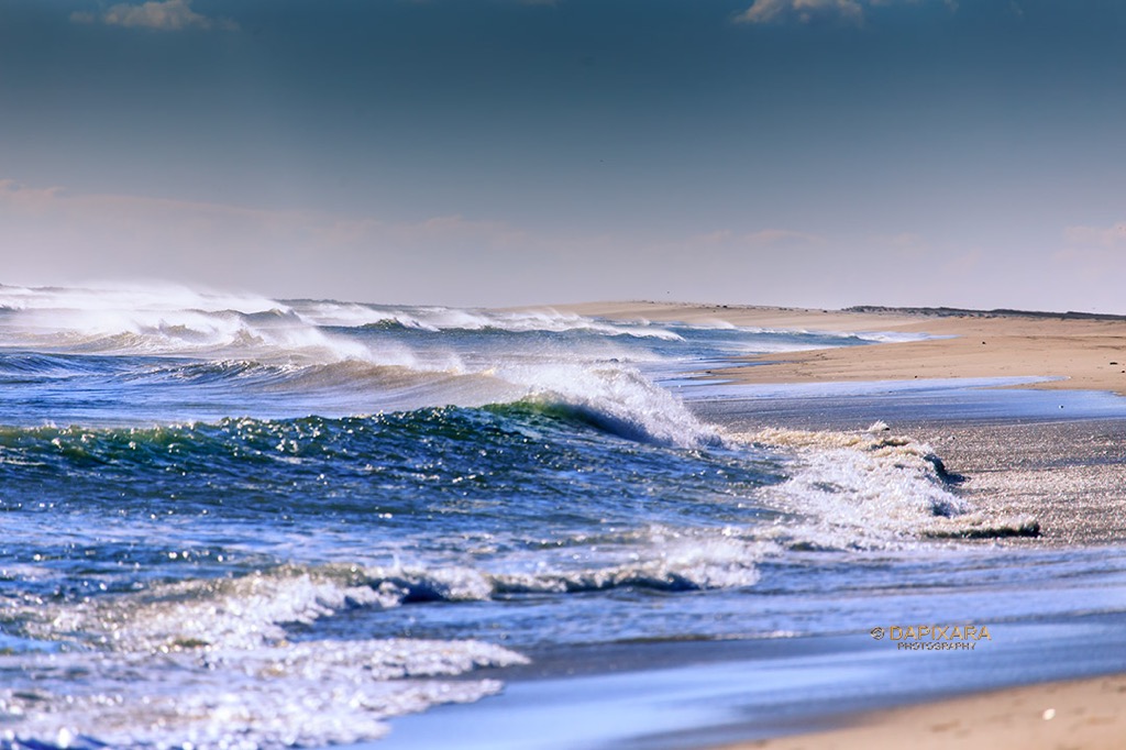 It's surreal and beautiful waves at Coast Guard beach in Eastham. Waves at Coast Guard beach. Cape Cod winter scenes by © Dapixara.